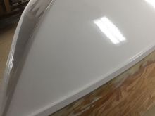The Replica's bottom.  Saturated with CPES, all seams glassed and epoxied over, 3 coats of "west Epoxy", 3 coats of Awlgrip 2-parts epoxy primer 3 coats of Awlgrip white.