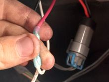 This is that same Red wire, we are currently looking through where the drivers side blinker would normally be (I took these pictures once I had the grill back on, but it is easier to do with the grill off, which you will already have done after installing the new headlights.