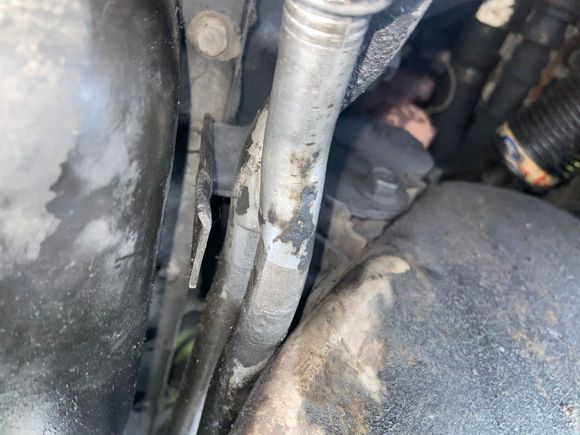 Oil cooler lines- bracket rubbed thru - caused big oil leak. Poor bracket design…