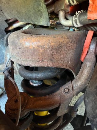 Had a rattle and this is the passenger side. 

The old shock on this side was missing bushings 