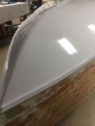 The Replica's bottom.  Saturated with CPES, all seams glassed and epoxied over, 3 coats of "west Epoxy", 3 coats of Awlgrip 2-parts epoxy primer 3 coats of Awlgrip white.