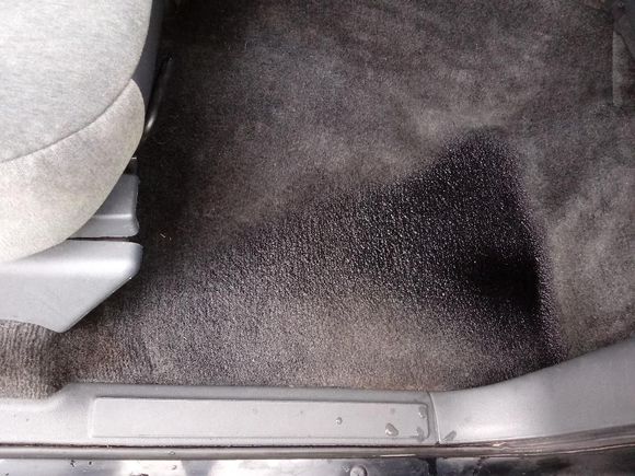 The puddle in the passenger side floor