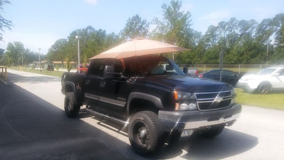 Beach umbrella through Sunroof is great way to help keep truck cab cooler during the Summer Months:>)