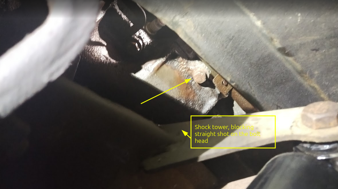 View of shock mount, blocking straight on access to bolt head. I can get at it with a universal.