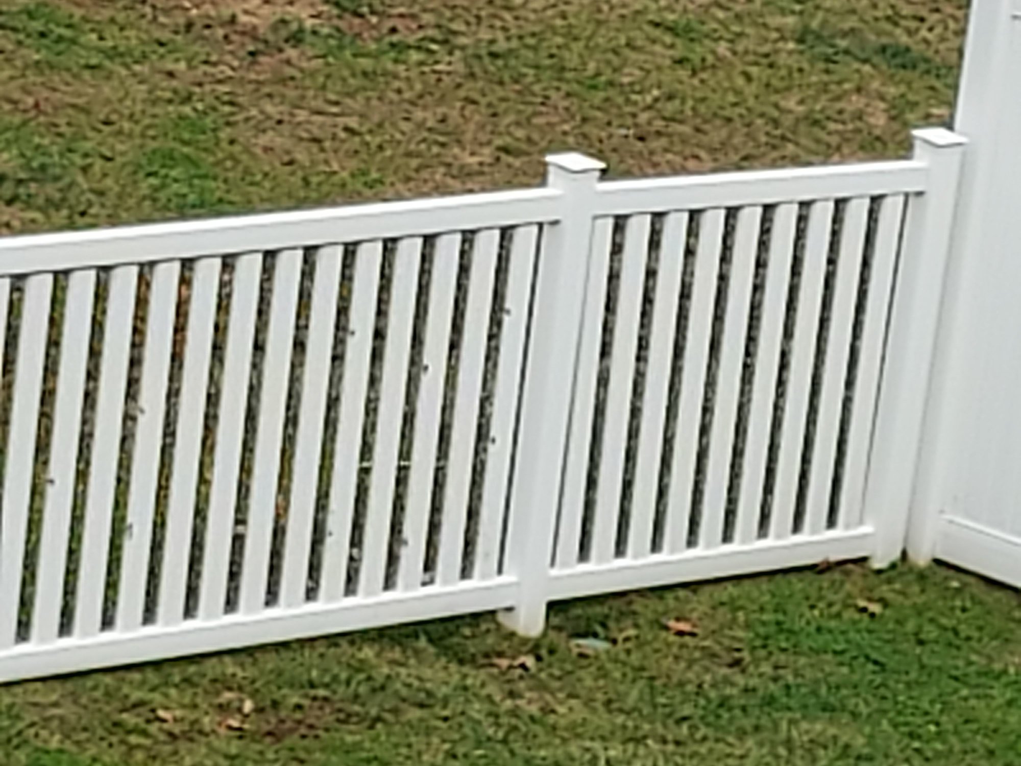 Southeast corner of my fence.  If you zoom in you will see multiple broken spots.  It was this area where the fence got it the worst.  I also have multiple fence post caps that have chucks out of them.