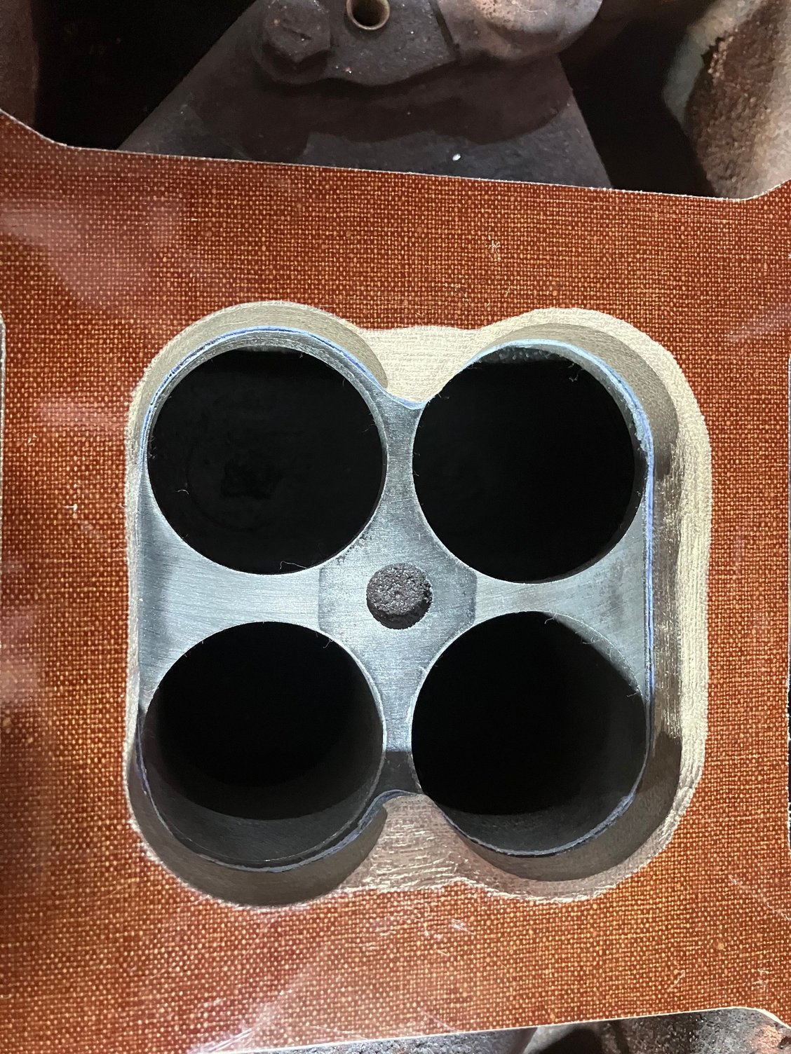 Modded a half inch spacer so I didn�t have to cut off the kick down linkage at carb
