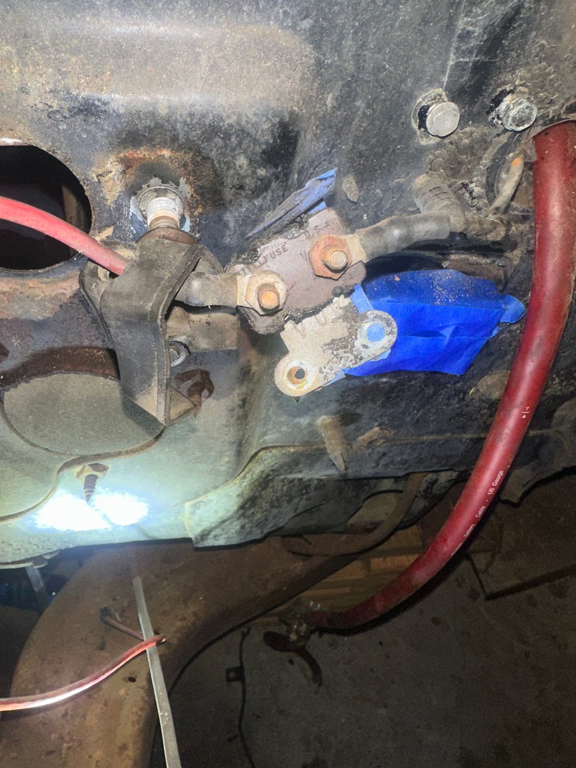 It�s not the horn relay on the fender. It bolts up to the two screws above the blue tape which is the bulk head. Painting my fire wall and I have a new under hood harness and don�t know what this is 