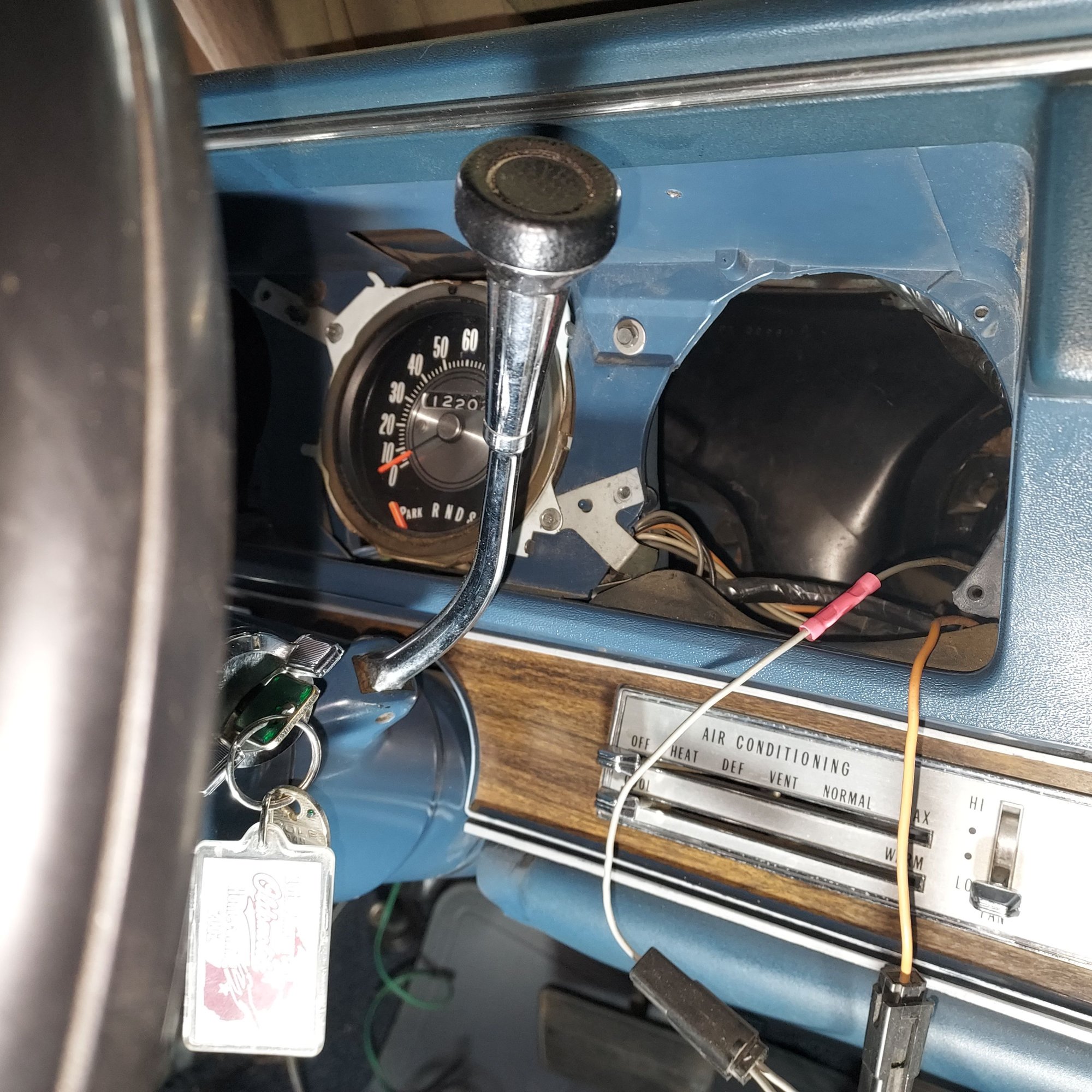Roll up sleeves- right arm thru clock hole and left arm thru gas gauge hole a real PIA. Telescoping mirror and forehead light-- UGH!
