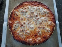 Chicago's Home Run Inn pizza, Italian Sausage and extra cheese.  Throw on a little Parmigiano Cheese and some crushed red pepper and you've got a whole lotta YUM!