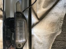 License plate light housing attached 