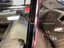 Should the driver's front window rear edge be close to flush against the leading edge seal of the rear window?