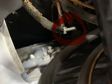 Found this loose screw with two wires attached to it. It is on the driver side of the brake booster. 