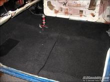 After first laying down several layers of sound deadener, the carpeting is getting installed.