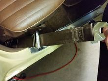 Rear seat belt retractor
