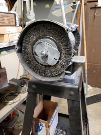 New wire wheel made in USA out of balance. Not much on the internet on how to balance a wire wheel. So I made this and it worked quite well!! Using a mower blade balancer..  This grinder has two wire wheels and even with my foot on the shelf of the pedestal it would chase all over.. Now it can run without any movement!! That's 1/8" steel plate. It could be trimmed considerable more, but it works..  