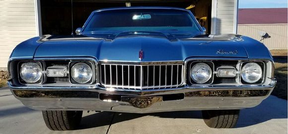 Repainted headlight housings, grill and added the jewelry.