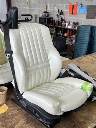 This front seats are from a 2001 BMW M3 convertible.  I had the upholstery shop recover them with Pearl White vinyl in the spirit of the factory buckets. There are a few wrinkles to be smoothed out.