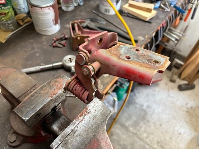 push the leaf of the hinge upward, releasing more tension