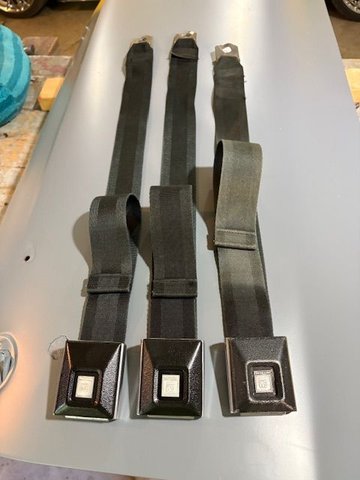 While I had the buckles apart, I removed what was left of the old black coating.  Seemed to be like a rubberized paint?  Not sure, but it didn’t look real good anymore.  So repainted the two on the left with satin black spray paint.  My thought at this time, is to just put a driver set and a passenger set on the bench seat.  Belts from that era are such a nuisance except when wearing them.  I will disassemble, clean, and paint the one on the right, and store the part.