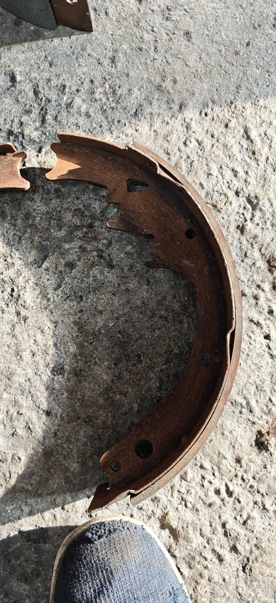 Correct trapezodial shape of park brake lever slot (top-most hole in the shoe)