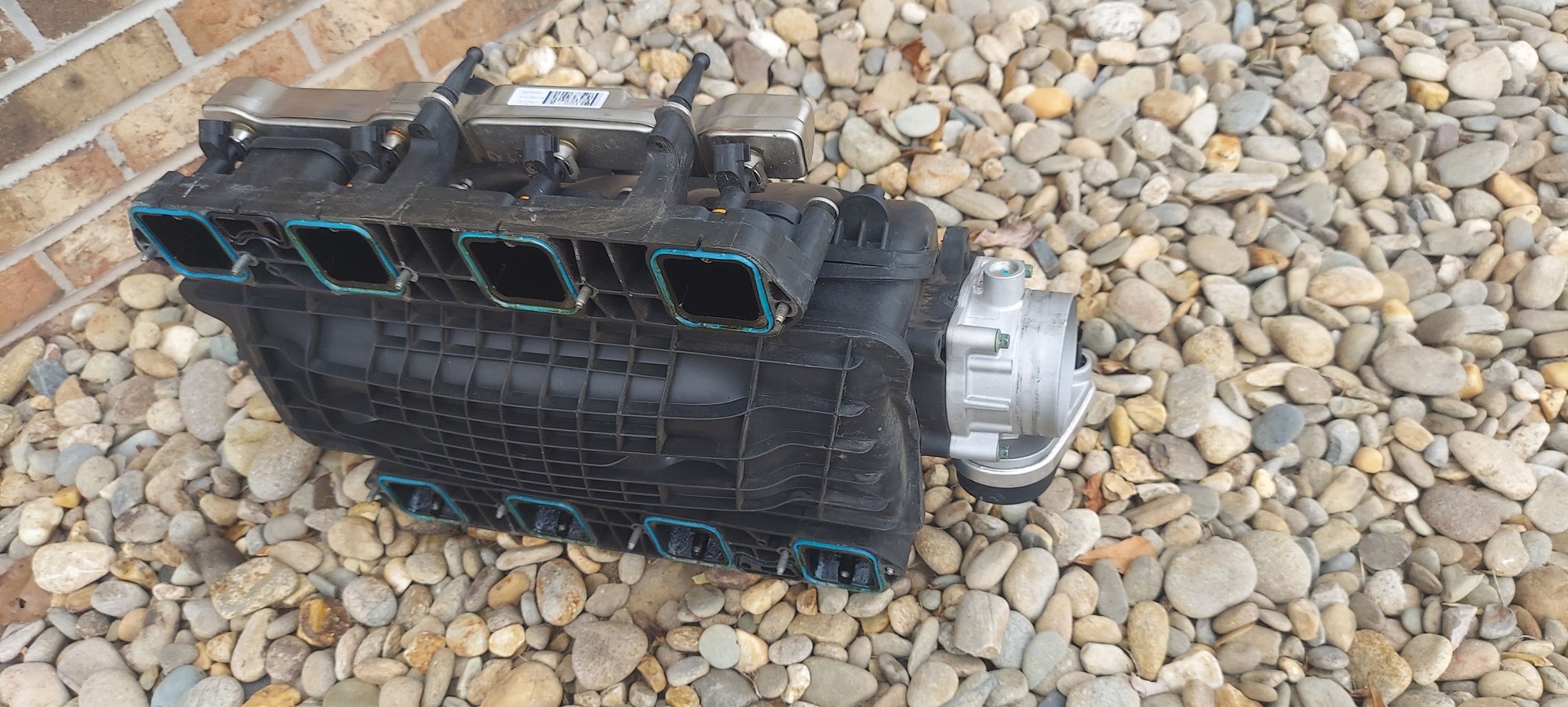 I wanted to use the standoff's on the fuel rail so that I could attach the 392 halfcovers I have.  The 6.1 intake uses standard bolts whereas the plastic uses 