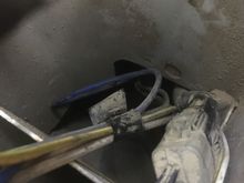 one of the two wiring harnesses tucked in behind the tail light 
