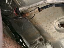 The connection to the line that goes up towards engine