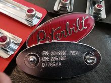 Pete badges that were replaced with red tunnel lites
In passenger and drivers door. 