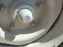 Passenger Side Front rim stuck by paint