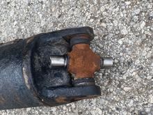 rear ujoint was much bigger and heavier than the front. I think they pressed a lighter duty or 2wd ujoint into the front on accident. 