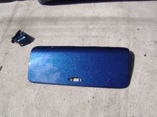 The glovebox door. That isnt a smear in the bottom corner, it the reflection of a cloud overhead. She is sharp. 