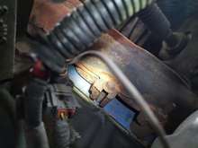 Middle of the driver side exhaust manifold, hard to get an angle but I can see pretty far into it.