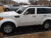The left side of my truck after I installed the mirror and door handle covers.