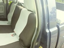 Seat covers getting installed.