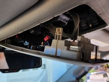 Unsnapped overhead console. Pull down from the rear, then unhook from the front.