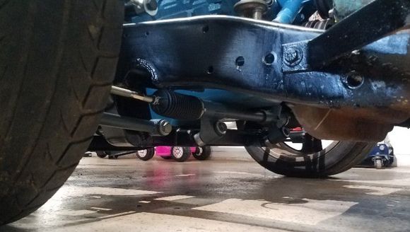 Lots of clearance....Not really though. Its about 6 inches at the cross member. My charger is about 4-1/2". So I am used to low cars.
