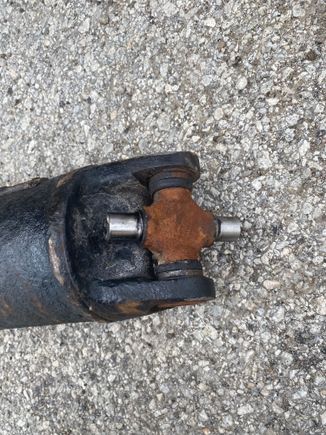 rear ujoint was much bigger and heavier than the front. I think they pressed a lighter duty or 2wd ujoint into the front on accident. 