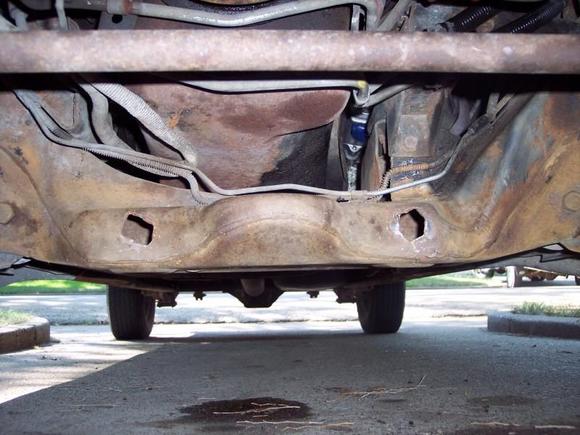 Holes in crossmember where steering gear attaching nuts pulled through the crossmember.