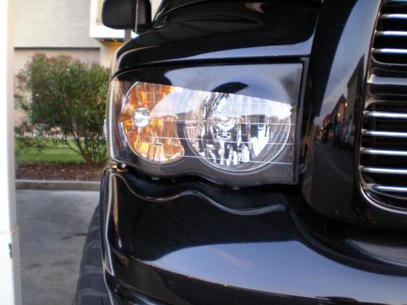 tinted marker light, black housing, eyelids