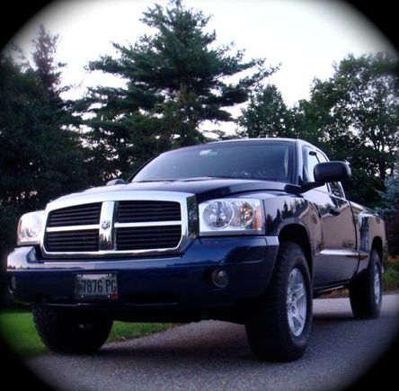 Paint matched front bumper, smoked license plate cover, black stubby antenna