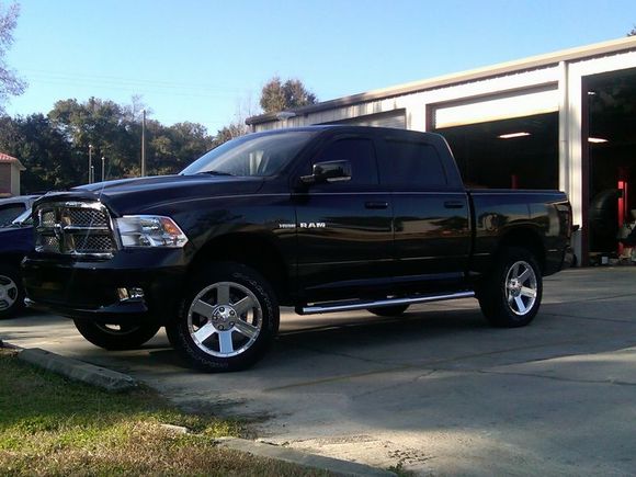 Bilstein 5100 shocks front (2.8" lift) and rear, Top Gun Customz 1.5" spacer on top of rear springs, Mopar polished forged aluminum 20" wheels.