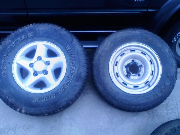 Old tires and rims on the right, new tires on the left. The rims were put on my Dads truck.