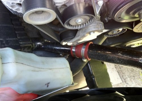 This is an aluminum 2.5" intake from my old eclipse GSX that I cut to fit with a hole on the underside of my airbox.  I now pull air from the fender(stock location) and from the front just below the radiator.