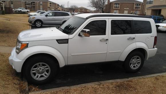 The left side of my truck after I installed the mirror and door handle covers.