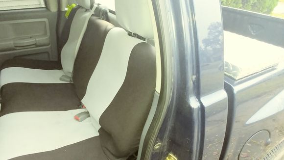 Seat covers getting installed.