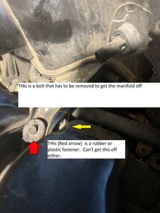 Pic 2 - yellow arrow shows the hidden bolt.  Red shows a rubber/plastic fastener that I don't know how to remove