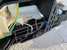 Micro switch has been removed. When the shift is depressed, it makes contact with the micro switch. The micro switch releases the shift lever from Park.
