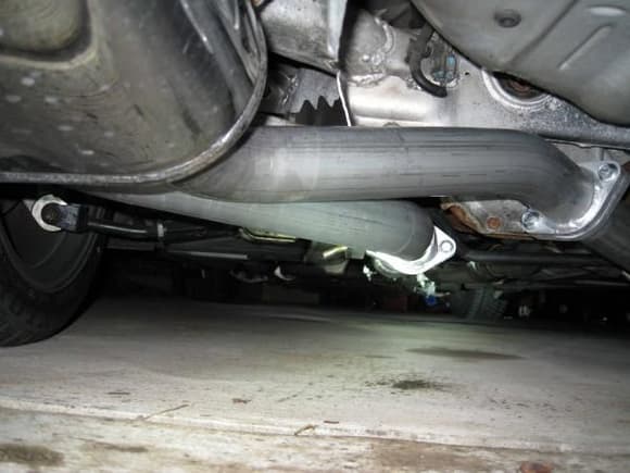 Dual pipes, one goes under the sway bar where the stock pipe was, the other goes just over the sway bar (right side in picture).