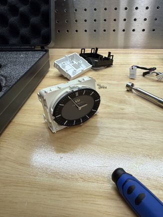 This is the 05-06 Clock. I took it apart down to the circuit board hoping to be able to fix it but unfortunately you can't fix them. there is 6 prongs on the board and there are 8 copper wires that have to touch the prongs to give the clock power. Over time the copper wires vibrate their way out and become disconnected. I don't really have the time to figure out a 6-digit password and I'm not sure anyone else does so I'm going to say they are not able to be fixed