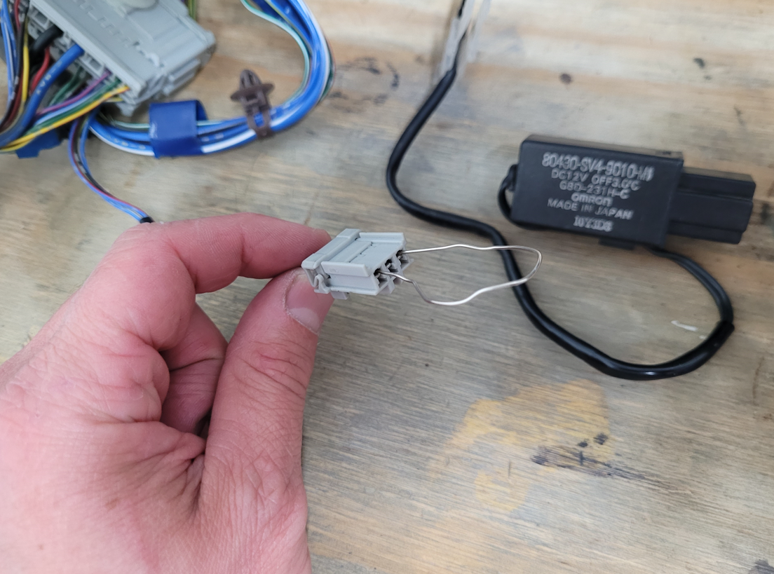 This is an example of what I did to this plug. This lume connects to the Evap thermo switch (In pic) and also connects to various other parts of the AC unit (Blower etc)